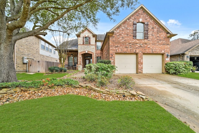 view of front of house featuring an attached garage, brick siding, fence, concrete driveway, and a front lawn