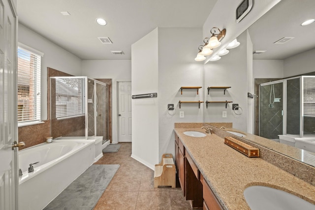 full bathroom featuring double vanity, visible vents, a shower stall, and a bath