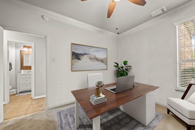 office area featuring ceiling fan, light colored carpet, visible vents, baseboards, and crown molding