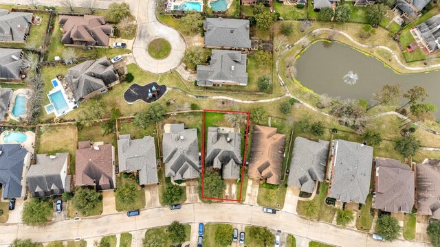 birds eye view of property with a residential view