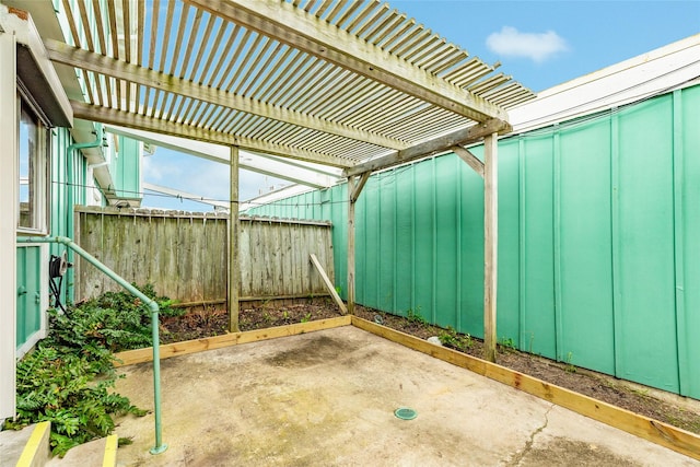 view of patio featuring fence and a pergola