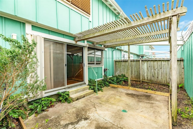 view of patio / terrace featuring entry steps, fence, and a pergola