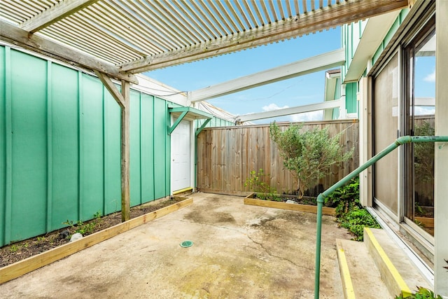 view of patio / terrace with fence and a pergola