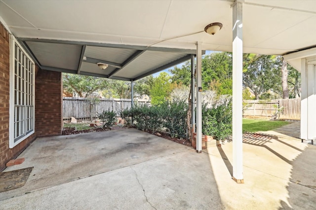 view of patio featuring fence