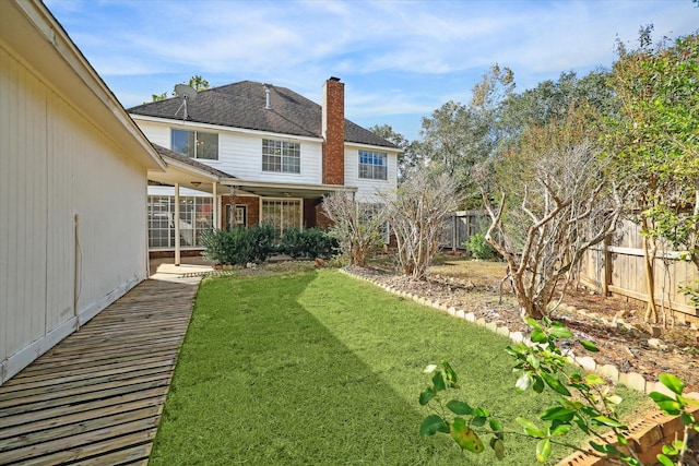 view of yard with a fenced backyard