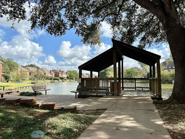 view of home's community with a residential view and a water view