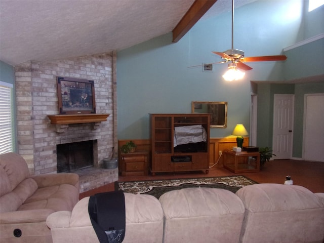 living area featuring visible vents, lofted ceiling with beams, a ceiling fan, a brick fireplace, and a textured ceiling