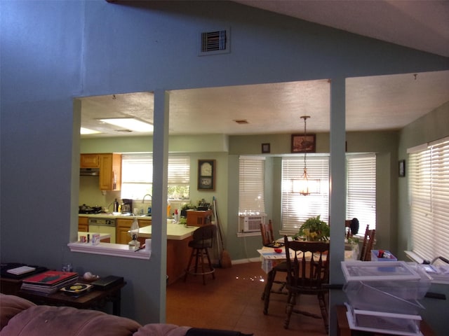 interior space with cooling unit, visible vents, and vaulted ceiling