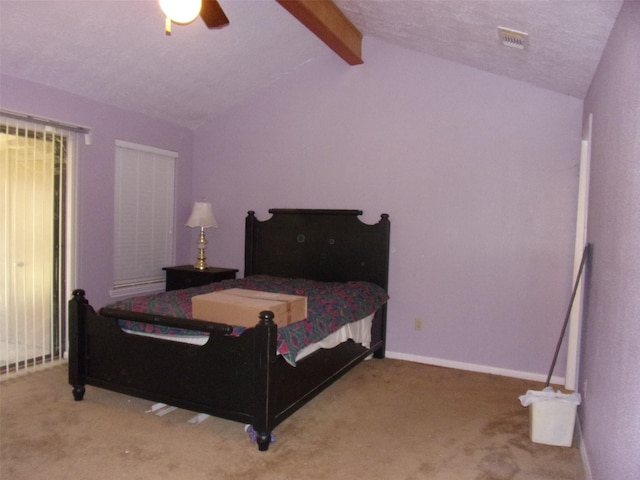 bedroom with carpet flooring, vaulted ceiling with beams, visible vents, and baseboards