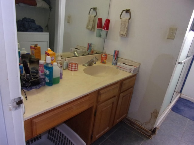 bathroom featuring tile patterned flooring and vanity