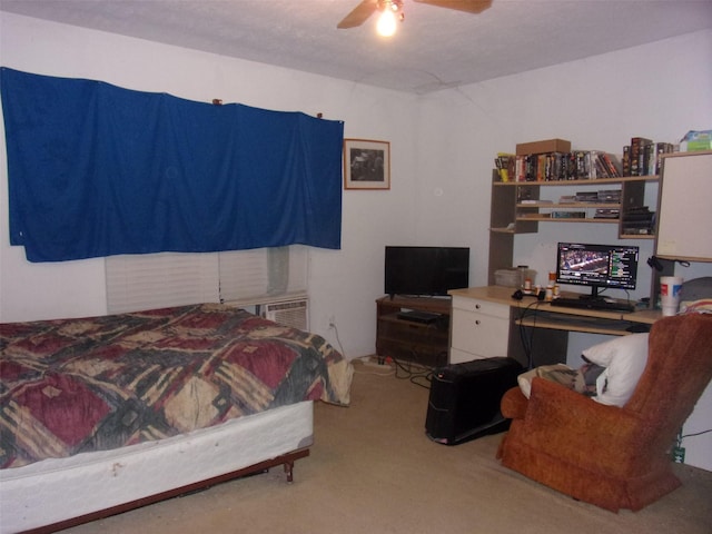 bedroom featuring ceiling fan and carpet