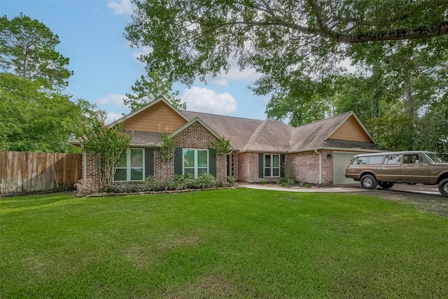 1234 Bergman Ct, Conroe, TX 77384 - ranch-style house with brick siding, a garage, and roof with shingles