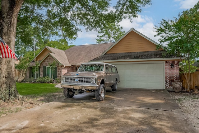 1234 Bergman Ct, Conroe, TX 77384 - view of front of property with brick siding, driveway, an attached garage, and roof with shingles