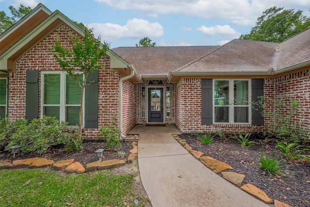 1234 Bergman Ct, Conroe, TX 77384 - property entrance featuring brick siding and roof with shingles