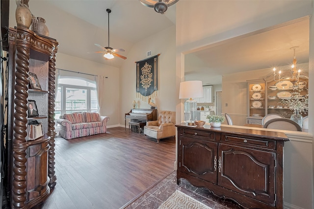 1234 Bergman Ct, Conroe, TX 77384 - living area with ceiling fan, high vaulted ceiling, dark wood-style floors, and a chandelier