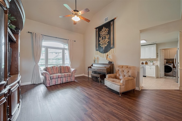 1234 Bergman Ct, Conroe, TX 77384 - sitting room with washer / clothes dryer, a ceiling fan, light wood-style floors, and high vaulted ceiling