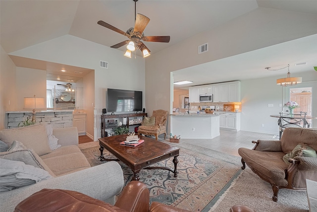1234 Bergman Ct, Conroe, TX 77384 - living room with ceiling fan, high vaulted ceiling, and light tile patterned floors