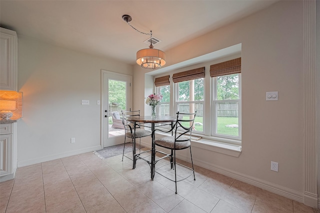 1234 Bergman Ct, Conroe, TX 77384 - dining room featuring a chandelier and light tile patterned floors