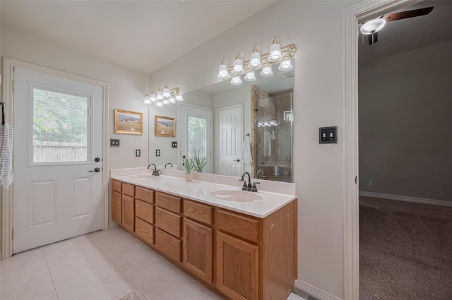 1234 Bergman Ct, Conroe, TX 77384 - full bathroom featuring double vanity, a shower stall, plenty of natural light, and tile patterned floors