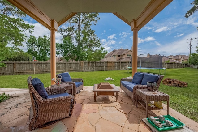1234 Bergman Ct, Conroe, TX 77384 - fenced backyard featuring a trampoline, a patio area, and outdoor lounge area