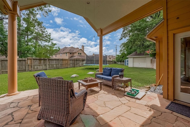 1234 Bergman Ct, Conroe, TX 77384 - fenced backyard with a trampoline, a patio area, an outbuilding, an outdoor hangout area, and a residential view