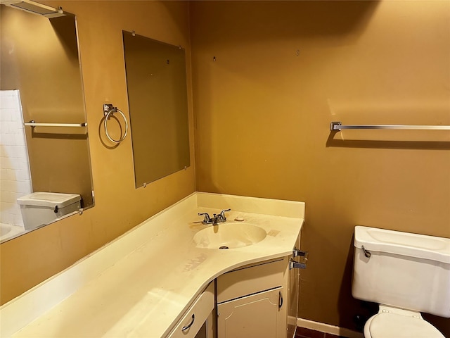 bathroom featuring vanity and toilet