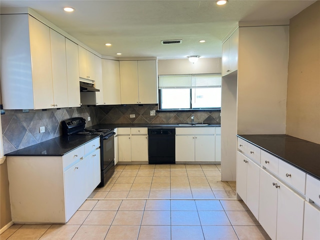 kitchen featuring dark countertops, visible vents, light tile patterned flooring, under cabinet range hood, and black appliances