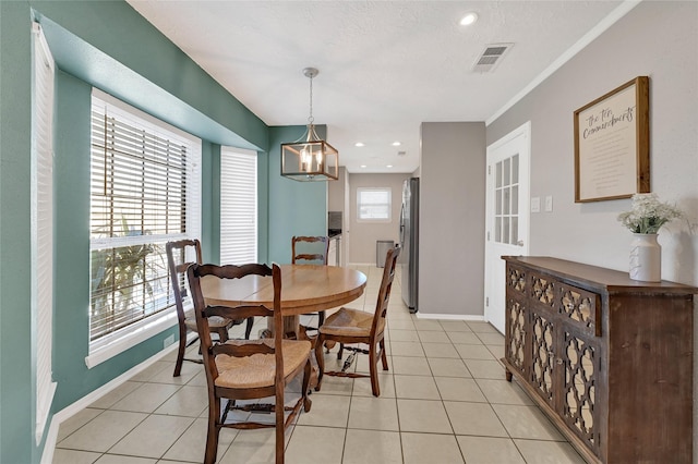 dining area with light tile patterned floors, recessed lighting, visible vents, and baseboards