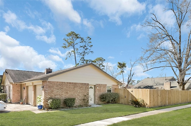 view of front of home with an attached garage, a front yard, fence, and brick siding