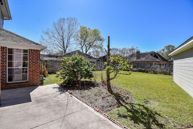 view of yard with a patio and fence