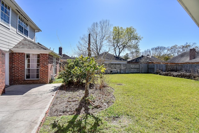 view of yard with a fenced backyard