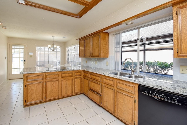 kitchen featuring brown cabinets, a sink, backsplash, a peninsula, and dishwasher