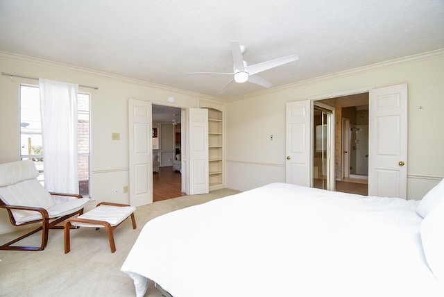 bedroom featuring light colored carpet, a ceiling fan, and ornamental molding