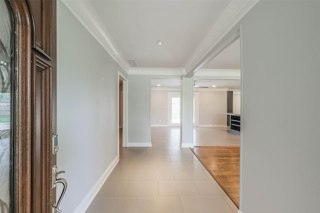 hall featuring visible vents, baseboards, ornamental molding, recessed lighting, and light tile patterned flooring