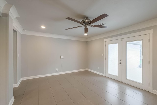 spare room featuring visible vents, ornamental molding, a ceiling fan, french doors, and baseboards