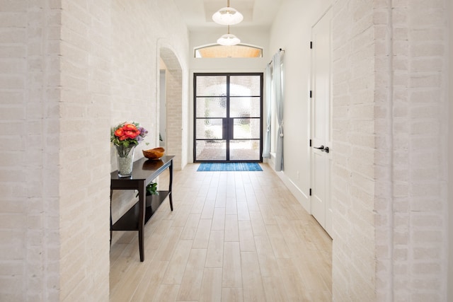 doorway with wood finished floors