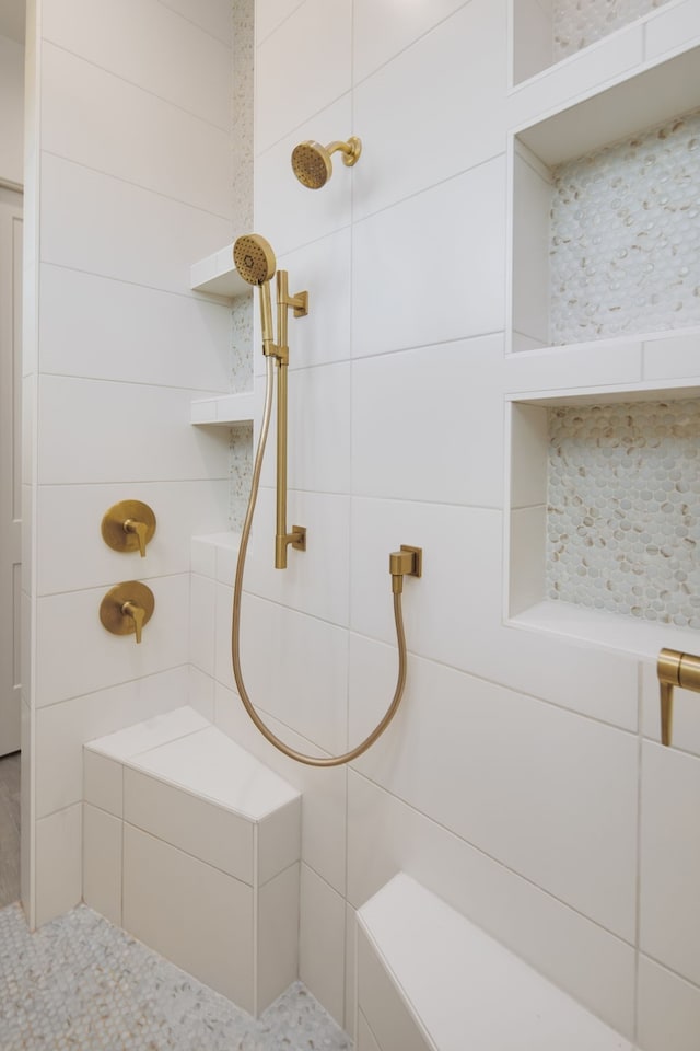 bathroom with tiled shower