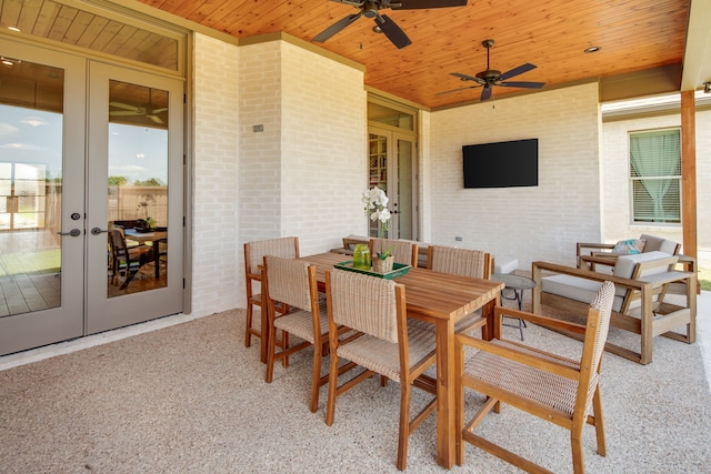 view of patio / terrace featuring a ceiling fan, outdoor dining space, and french doors