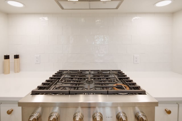 room details featuring stainless steel gas cooktop and light countertops