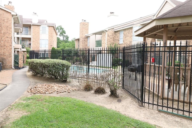 view of gate featuring fence