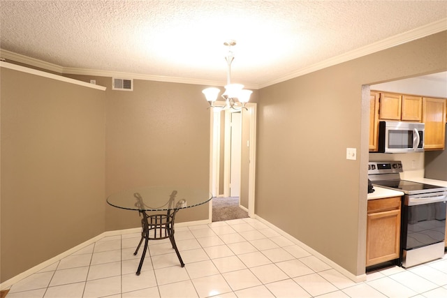 kitchen with an inviting chandelier, visible vents, appliances with stainless steel finishes, and crown molding