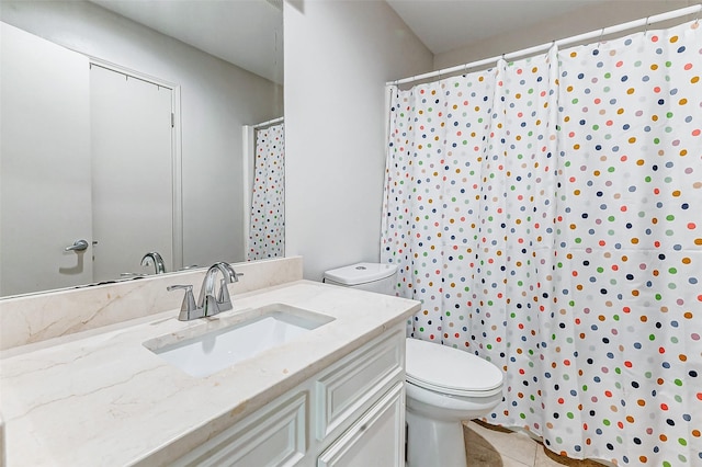 bathroom with toilet, tile patterned floors, curtained shower, and vanity