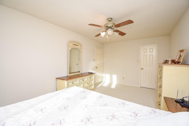 bedroom with light carpet, baseboards, and ceiling fan