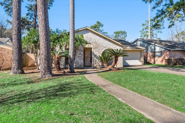 view of front of home featuring driveway, a garage, fence, a front yard, and brick siding