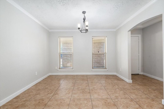 unfurnished dining area with baseboards, arched walkways, a textured ceiling, and light tile patterned flooring