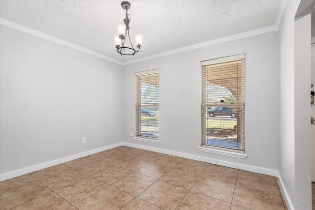 unfurnished room with baseboards, a chandelier, and crown molding