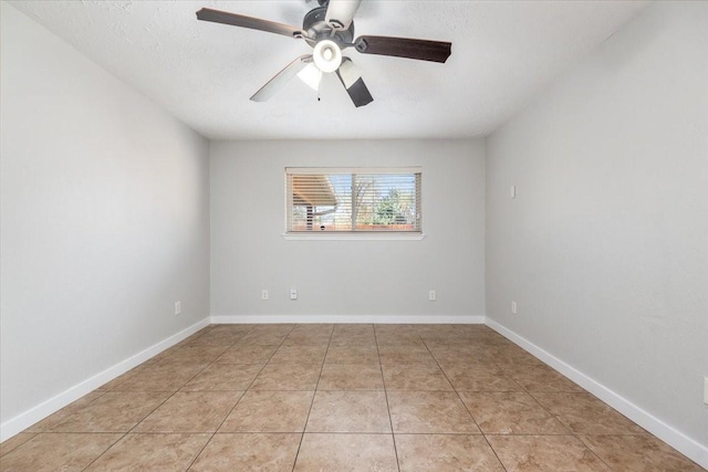 unfurnished room featuring light tile patterned floors, a textured ceiling, baseboards, and a ceiling fan