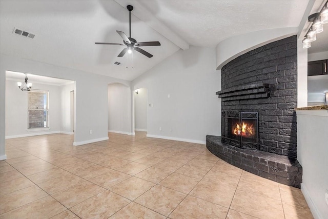 unfurnished living room with baseboards, a fireplace, visible vents, and a ceiling fan