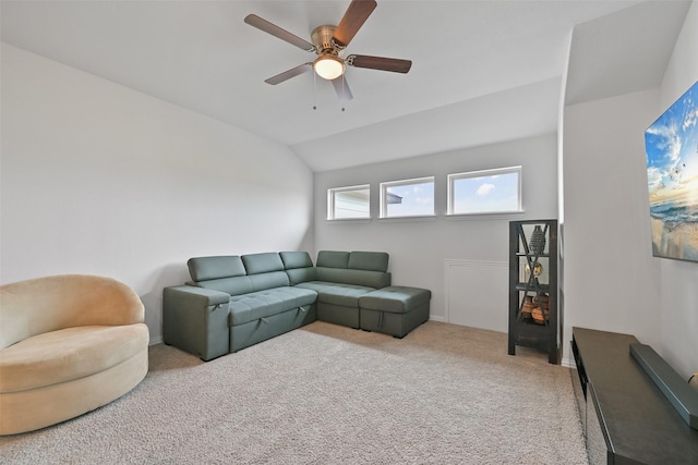 carpeted living area featuring lofted ceiling and ceiling fan