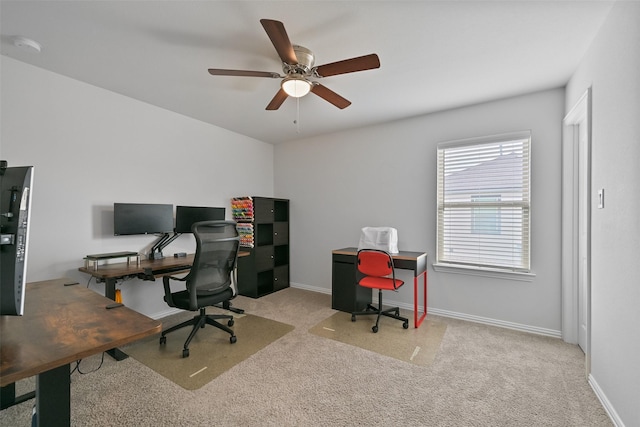 office with carpet floors, a ceiling fan, and baseboards